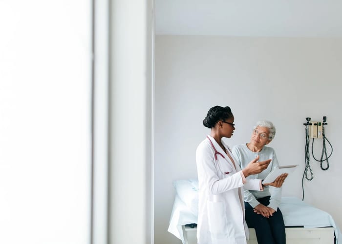 Doctor and patient in a warm, trusting conversation at Silva Family Center
