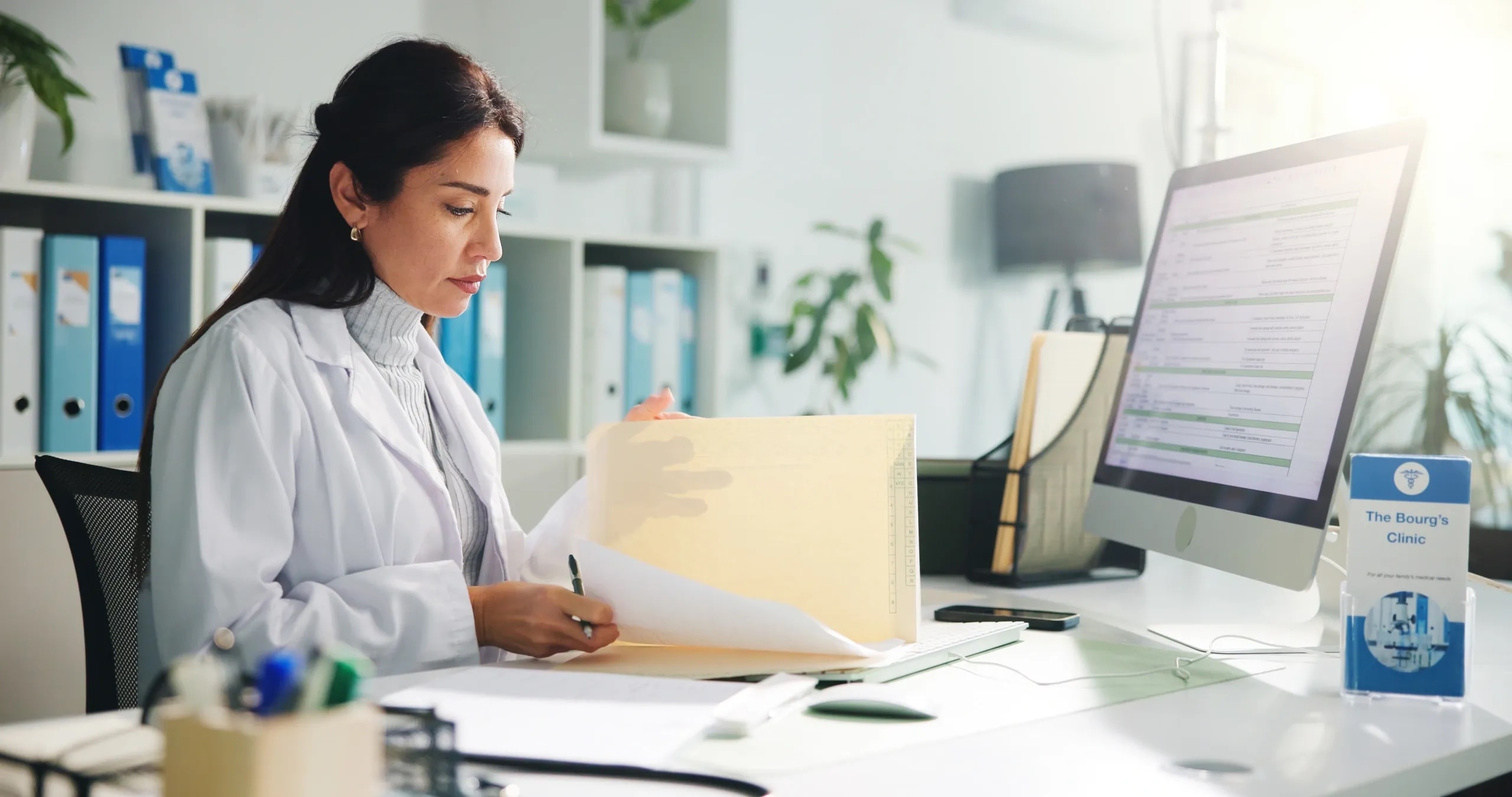 Doctor reviewing patient health records for chronic disease management